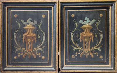pair of black and gold painted cabinet doors with a horse and flower design