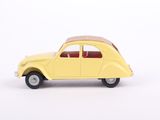 yellow toy car on a white surface with a white background