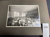 an old black and white photo of a classroom full of children