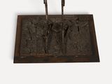 a bronze sculpture of a man and a woman on a horse