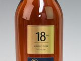 an image of a bottle of whisky sitting on a white surface
