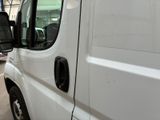 a white van that is parked in a parking lot