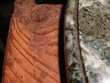 a close up view of a piece of wood on a table