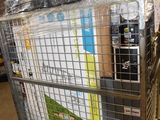 a metal cart with many items in it in a warehouse