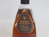 an image of a bottle of brandy sitting on a white surface