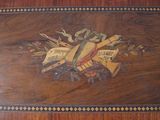 a wooden table with a decorative design on it