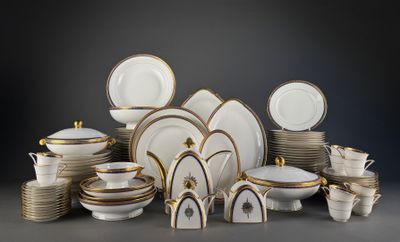 many different types of plates and bowls on the table