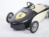 a toy car that is sitting on a white surface