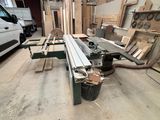 several pieces of wood are stacked on a table in a workshop