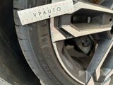 a close up of a tire with a measuring tape on it