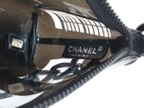 a close up of a cell phone with a cord attached to it