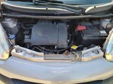 a car that has its hood open with the engine in it