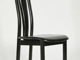 the chair is black and has a leather seat on it