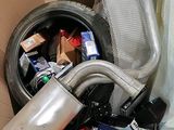 a cardboard box filled with assorted items in it