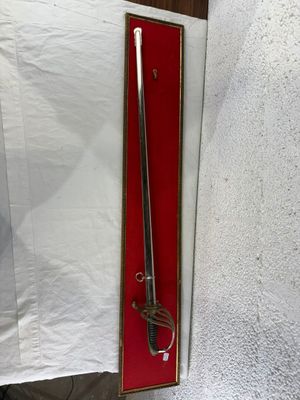 a sword that is on display in a box