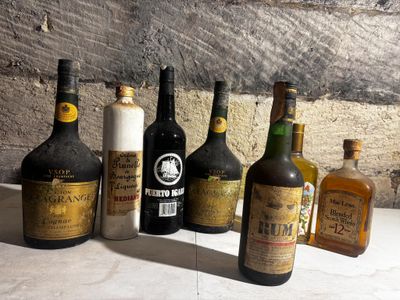 several bottles of wine are lined up on a table