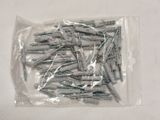 a bag of screws on a table with a white background