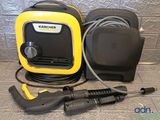 a close up of a yellow and black pressurer on a tiled floor