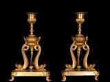 pair of antique brass candlesticks on marble bases
