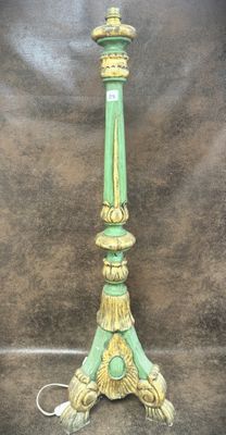 a green lamp that is sitting on a table
