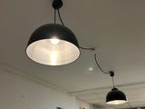 two lamps hanging from the ceiling in a room