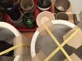 two pots and a tray with a yellow tape on them