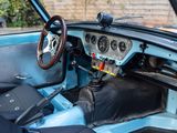 a blue car with a steering wheel and a dashboard