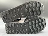 a close up of a pair of shoes on a white surface