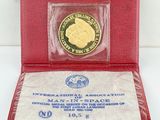 an image of a red case with a gold coin in it
