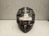 a close up of a helmet on a table with a tag on it