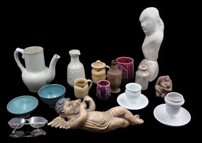 many different types of vases and bowls on the table