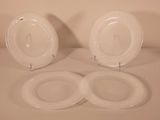 two plates that are sitting on top of a table