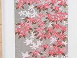 a close up of a picture of flowers on a wall