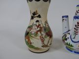 two vases sitting next to each other on a table
