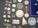 a lot of medals and other items on the table