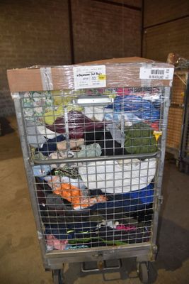 a cart full of luggage sitting in a warehouse