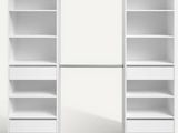 a close up of a white bookcase with drawers and shelves