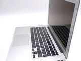 a laptop computer that is sitting on a white table