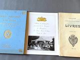 three books sitting on top of a table next to each other