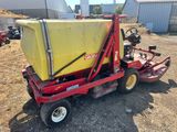 an image of a red tractor with a yellow container on the back