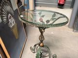 a table with a glass top and a fan on it
