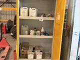 a yellow cabinet in the middle of a warehouse filled with items