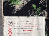 a patch of fabric that has a label on it