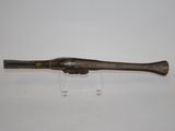 an old baseball bat on a clear stand on a white surface