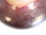 a close up of a metal object with a heart on it