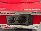 a box with two speakers in it sitting on the floor