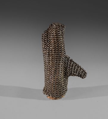 a close up of a metal object on a white surface