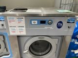 a photo of a washing machine and dryer in a store