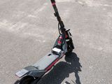 an electric scooter is parked in front of a building