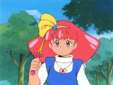 an image of a woman in a red hat holding a fan